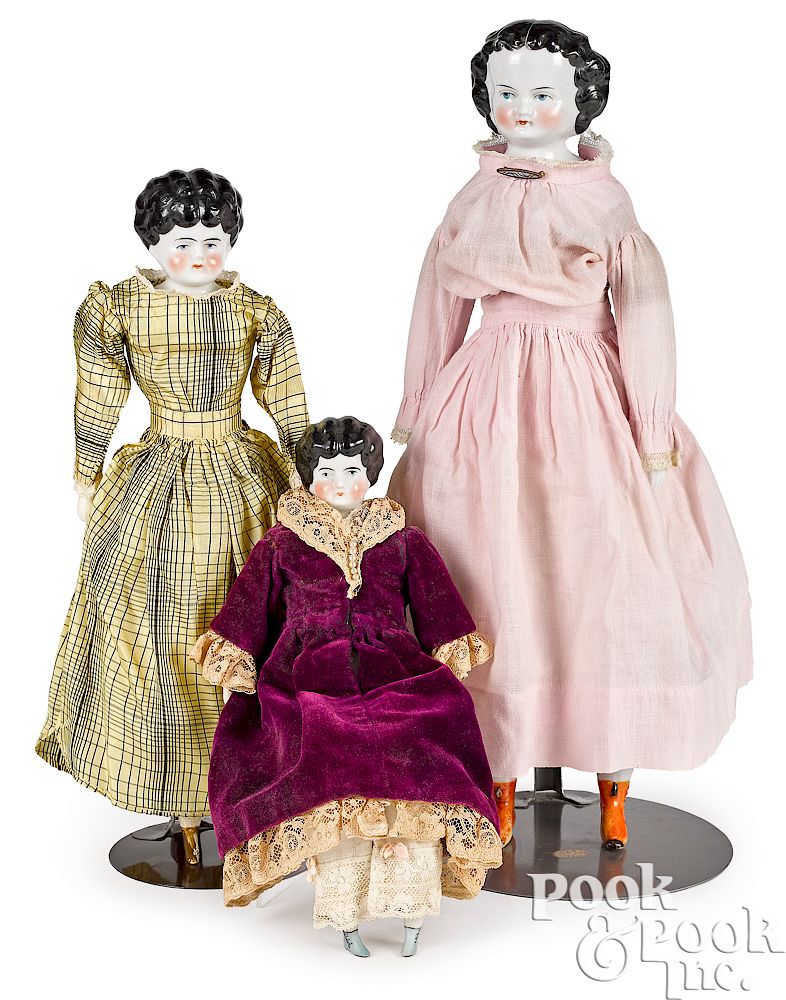 Appraisal: Three molded hair china head dolls Three molded hair china