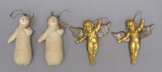 Appraisal: -Dresden cherubs -batting snowmen Two pairs of antique ornaments Pair