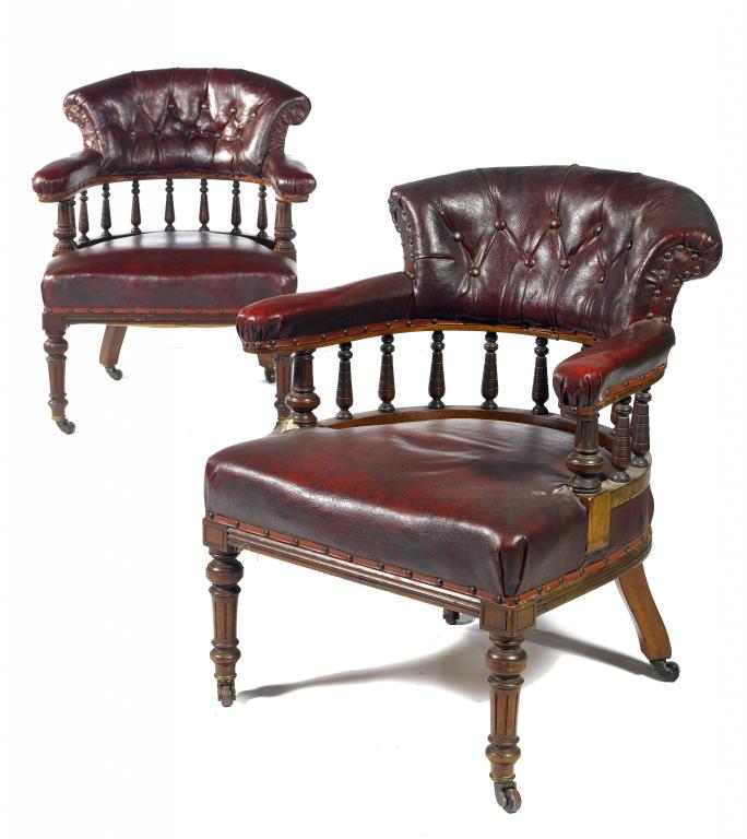 Appraisal: A PAIR OF VICTORIAN WALNUT ARMCHAIRS the upholstered armbow on