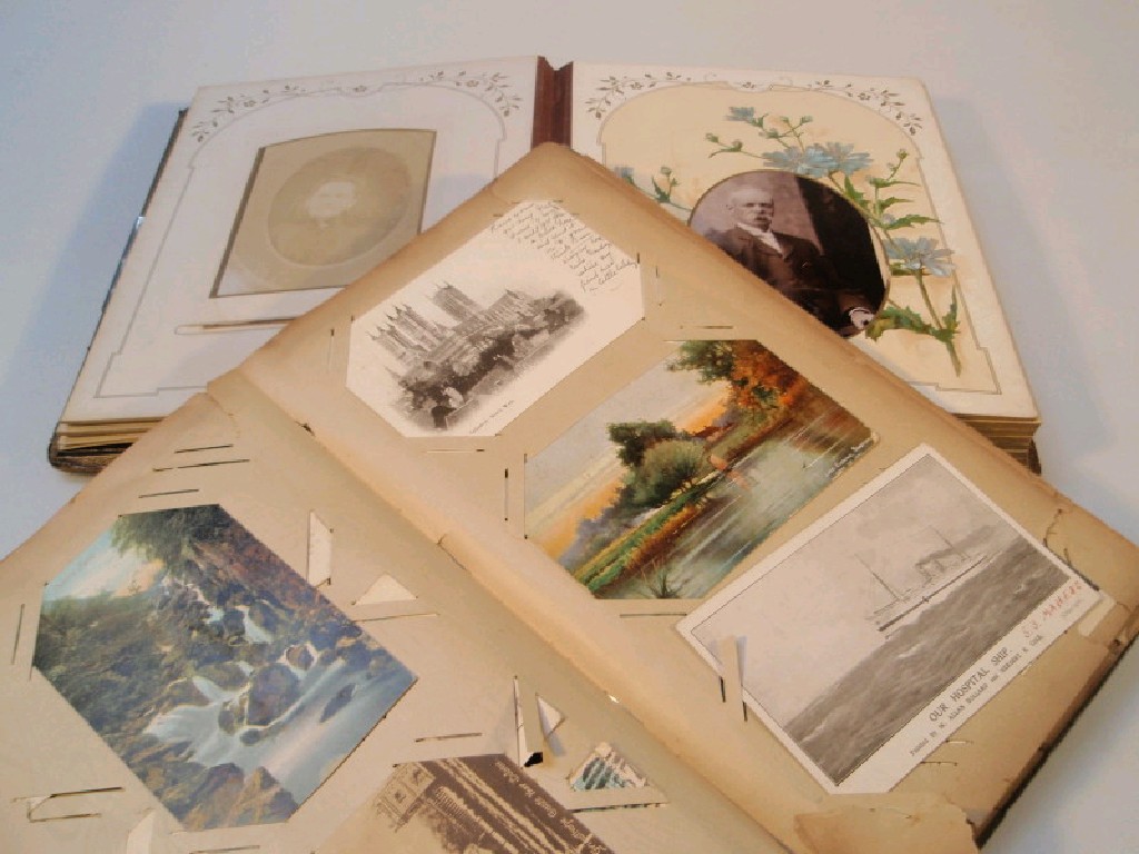 Appraisal: A postcard album with British topographical cards and a leather-bound