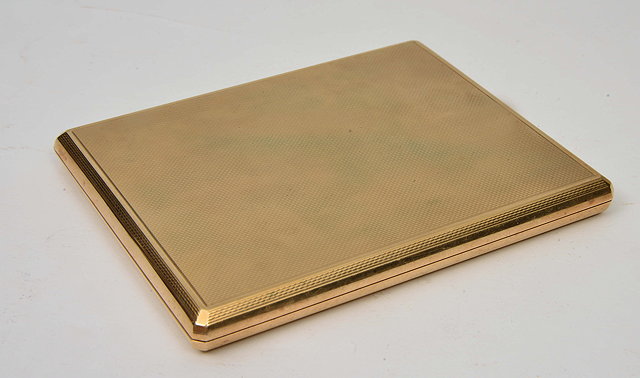 Appraisal: AN ELIZABETH II CT GOLD DUNHILL CIGARETTE CASE with engine