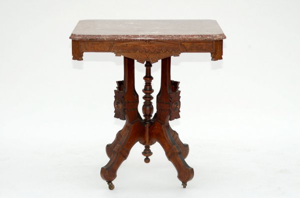 Appraisal: Eastlake table Tennessee marble top with cut corners Ornate walnut