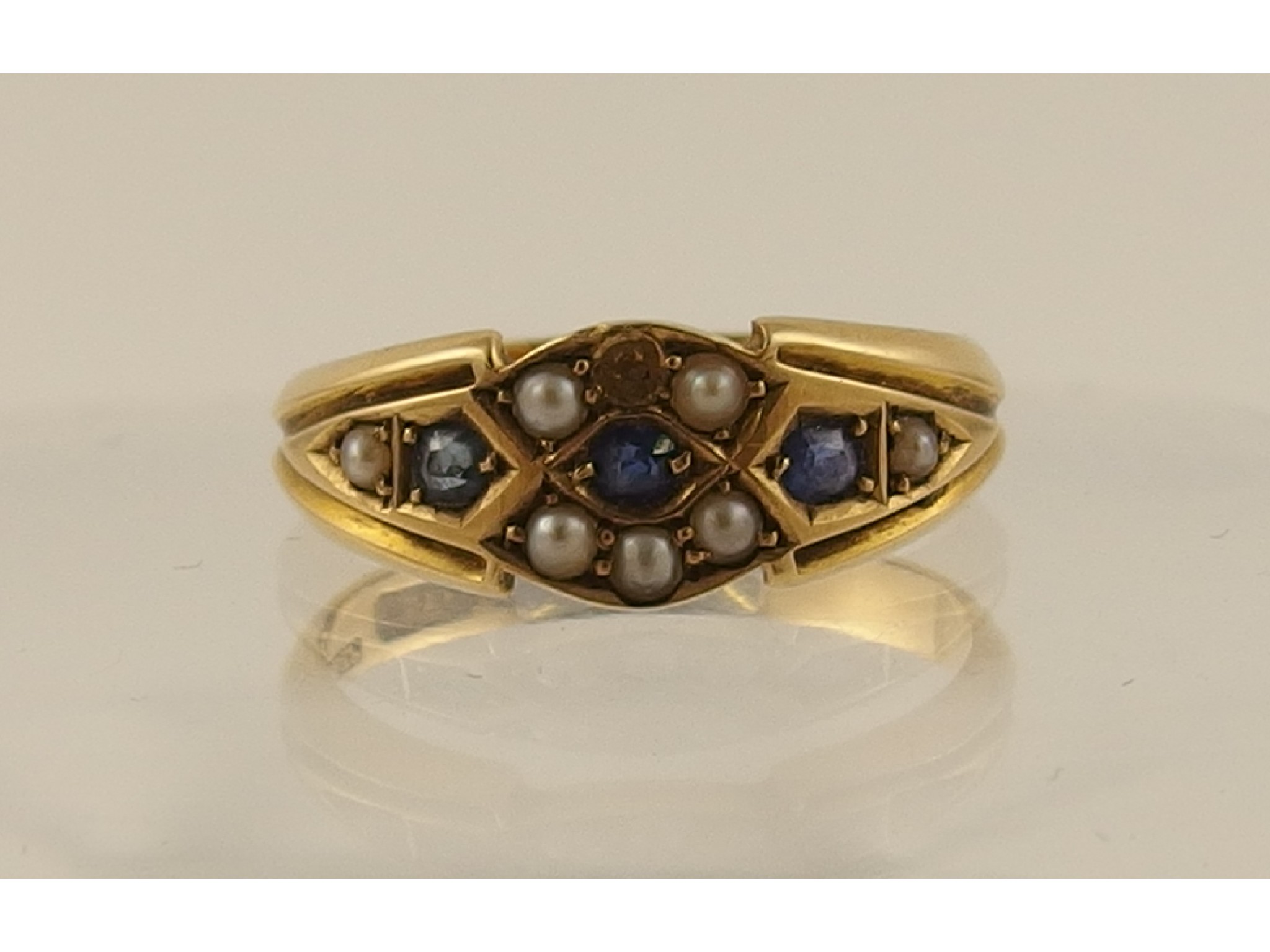 Appraisal: A Victorian sapphire and half pearl ct ring