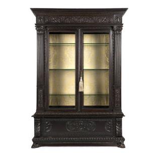 Appraisal: An ebonized carved oak vitrine cabinet Late th century constructed