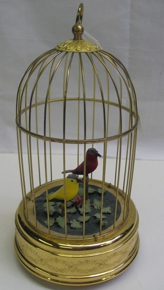 Appraisal: A SWISS MUSICAL AND MECHANICAL BIRD CAGE The red and