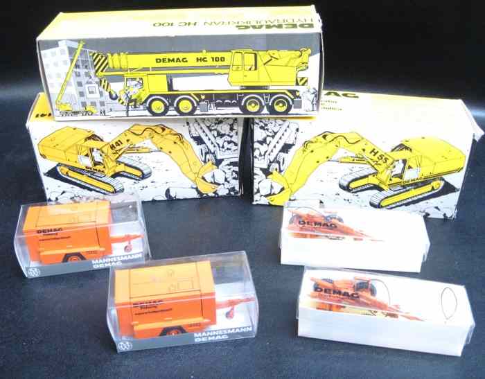 Appraisal: SEVEN DIECAST SCALE MODELS OF DEMAG EQUIPMENT five are NZG