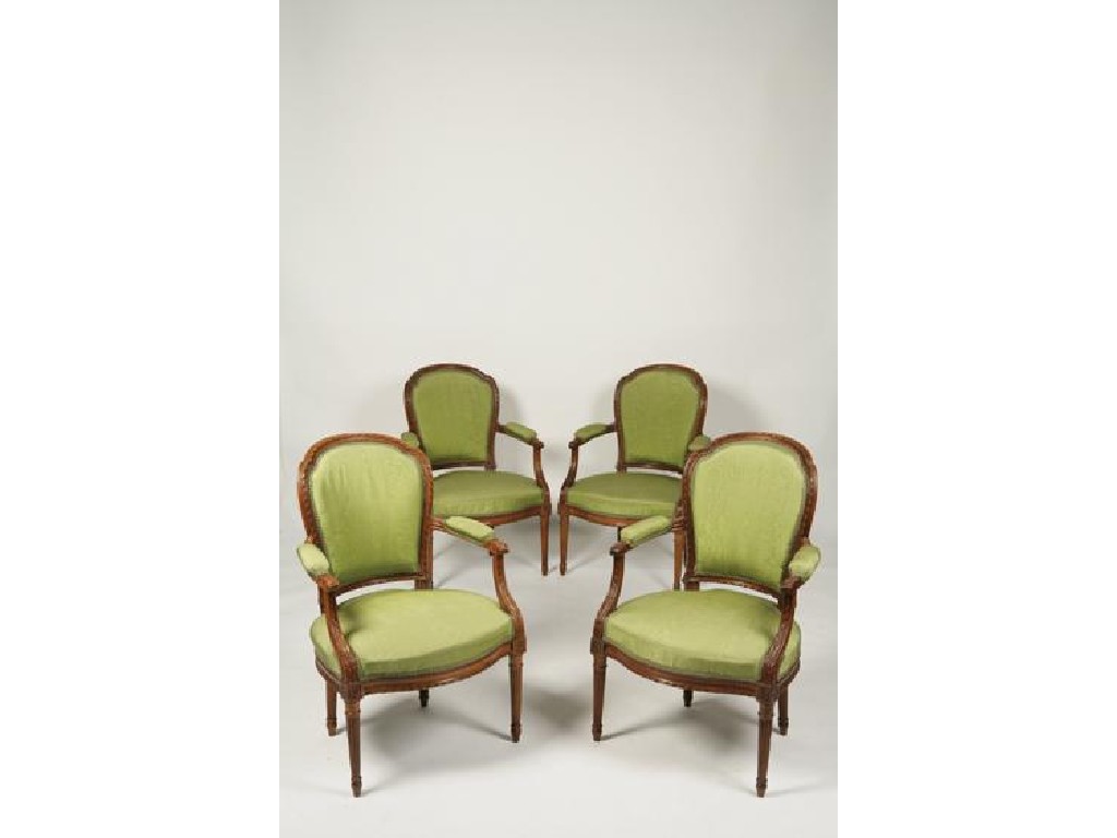 Appraisal: A SET OF FOUR LOUIS XVI ARMCHAIRS with ribbon-carved frames