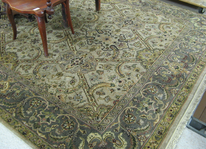 Appraisal: HAND KNOTTED ORIENTAL CARPET Indo-Persian overall floral decoration on ecru