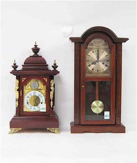 Appraisal: TWO ANTIQUE REPRODUCTION MAHOGANY CASE CLOCKS triple train time chime