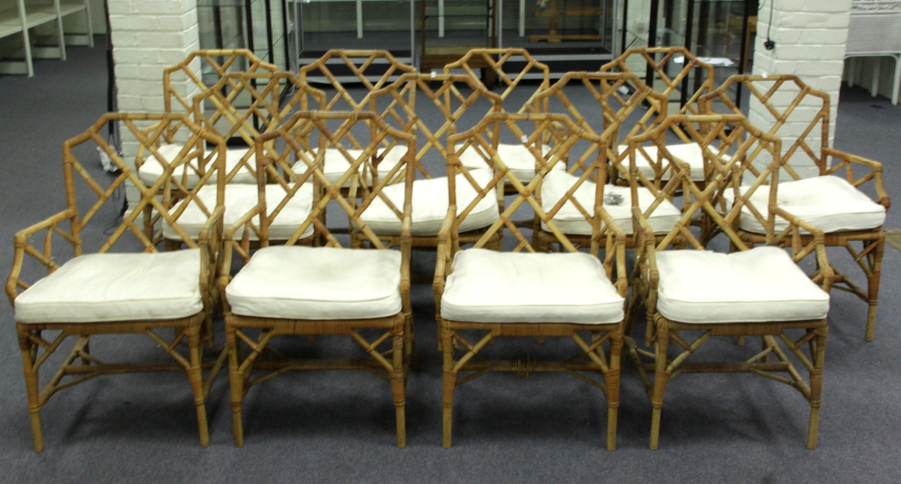 Appraisal: A set of twelve cane and bamboo armchairs with lattice