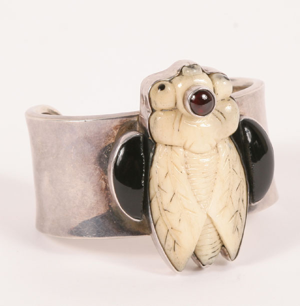 Appraisal: Modern chunky sterling cuff bracelet mounted with a carved bone