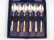 Appraisal: A boxed set of six silver and enamel coffee spoons