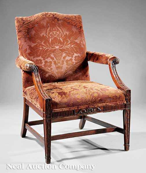 Appraisal: A George III Carved Mahogany Library Chair th c arched