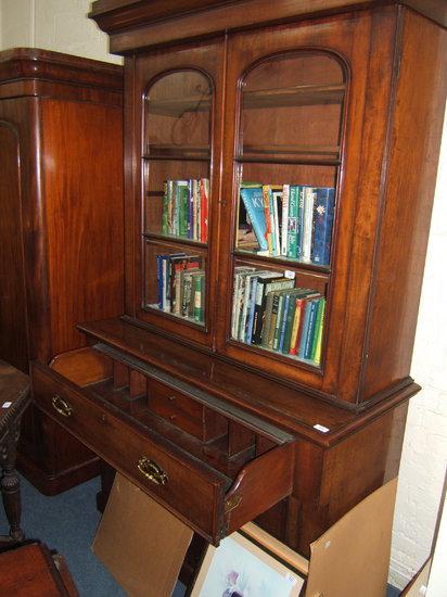 Appraisal: A Victorian mahogany secretaire bookcase cabinet with glazed doors above