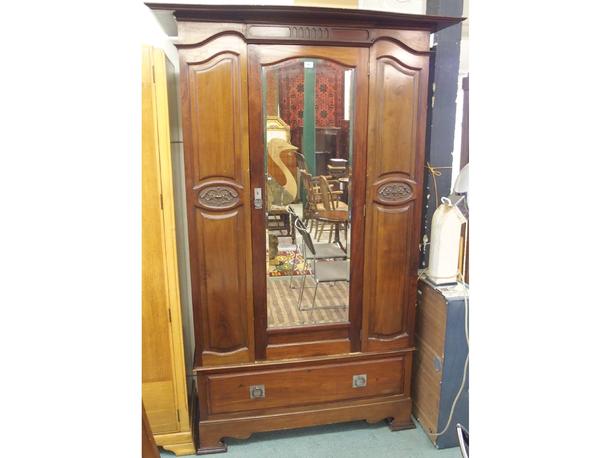 Appraisal: A Victorian mahogany single mirrored door wardrobe with single drawer