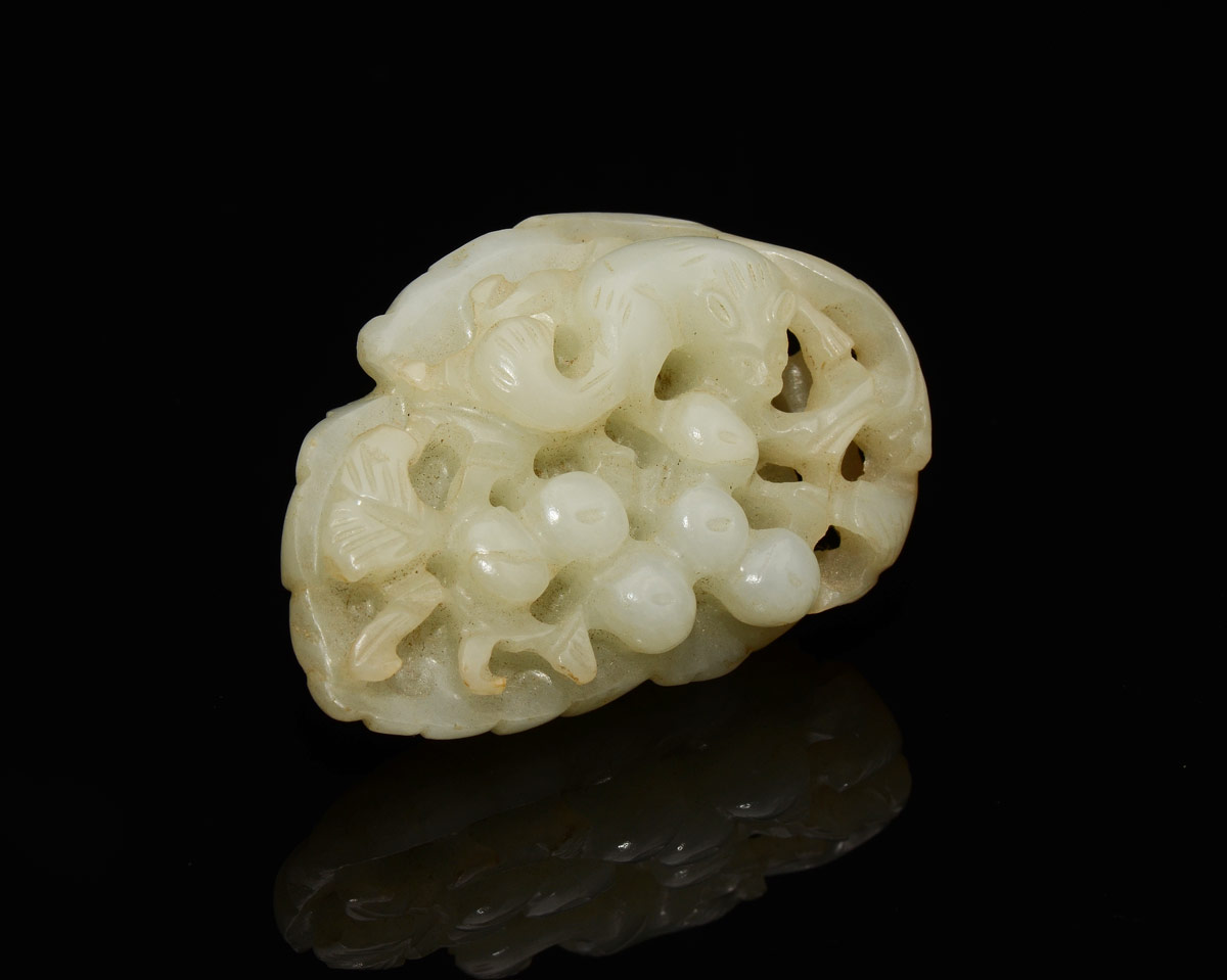 Appraisal: CHINESE CARVED WHITE JADE FIGURAL LEAF Figural leaf with clusters