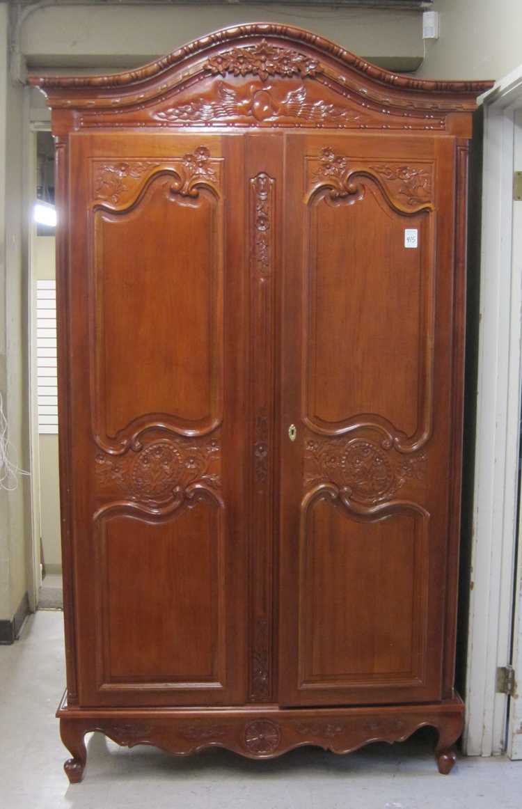 Appraisal: LOUIS XV STYLE CARVED MAHOGANY ARMOIRE having an arch top