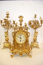 Appraisal: A FRENCH GILT METAL CLOCK GARNITURE