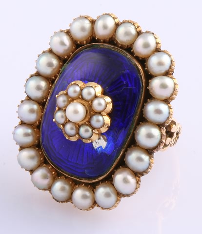 Appraisal: KY mm round pearls surrounding a cushion shaped blue enamel