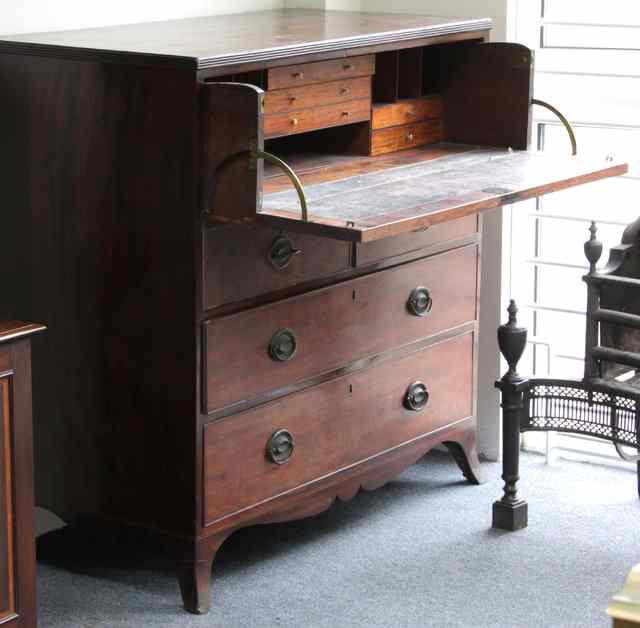 Appraisal: A Regency mahogany secretaire chest with fitted drawer above two