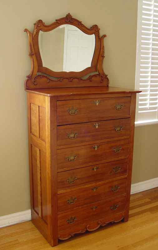 Appraisal: MAHOGANY TALL CHEST WITH MIRROR drawer chest with brass hardware