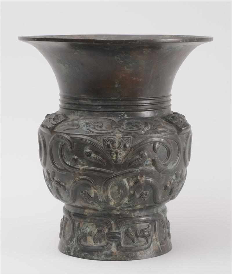 Appraisal: CHINESE ARCHAISTIC RELIEF-DECORATED BRONZE VESSEL With squat spherical bowl flared