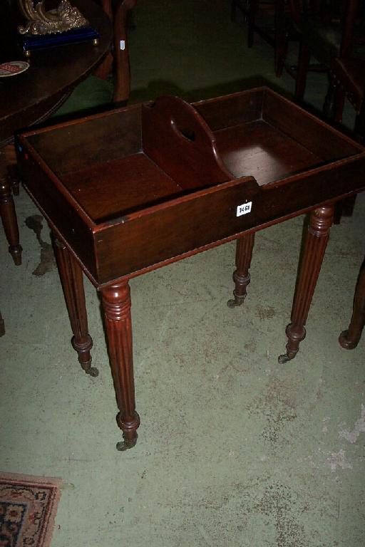 Appraisal: A th century mahogany butlers table the central division with