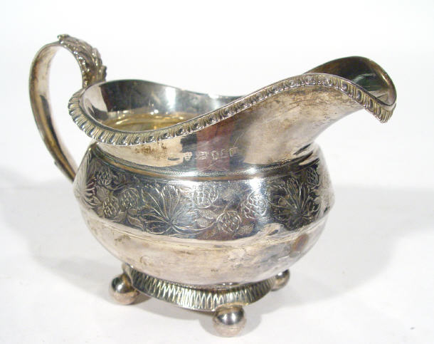 Appraisal: Georgian silver cream jug with acanthus leaf design handle chased