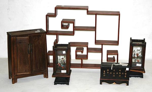 Appraisal: Including one multi-shelf display stand a miniature two-door cabinet a