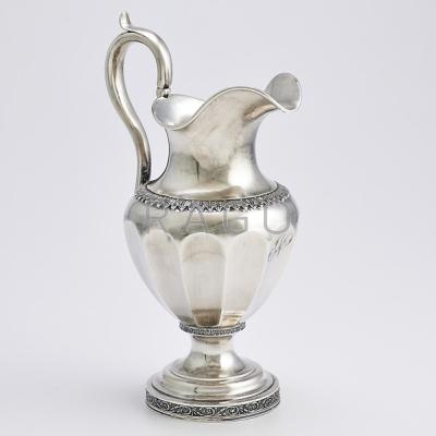 Appraisal: AMERICAN COIN SILVER WATER PITCHER Faceted urn form with applied