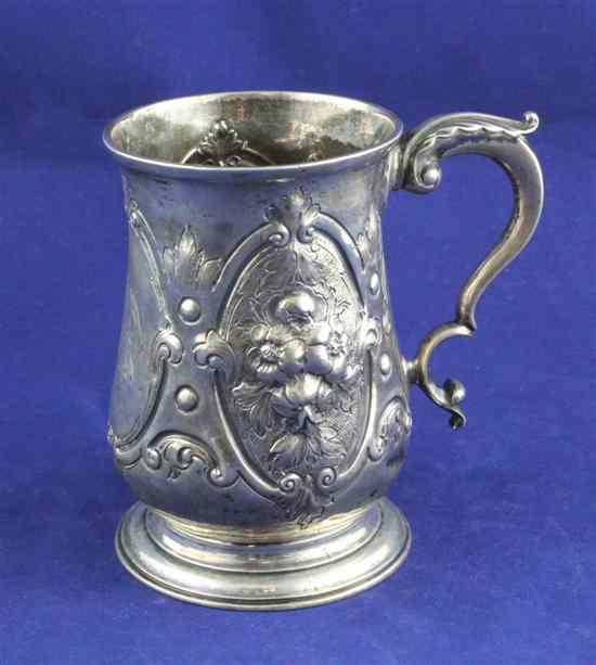 Appraisal: A George III silver baluster mug with later embossed decoration