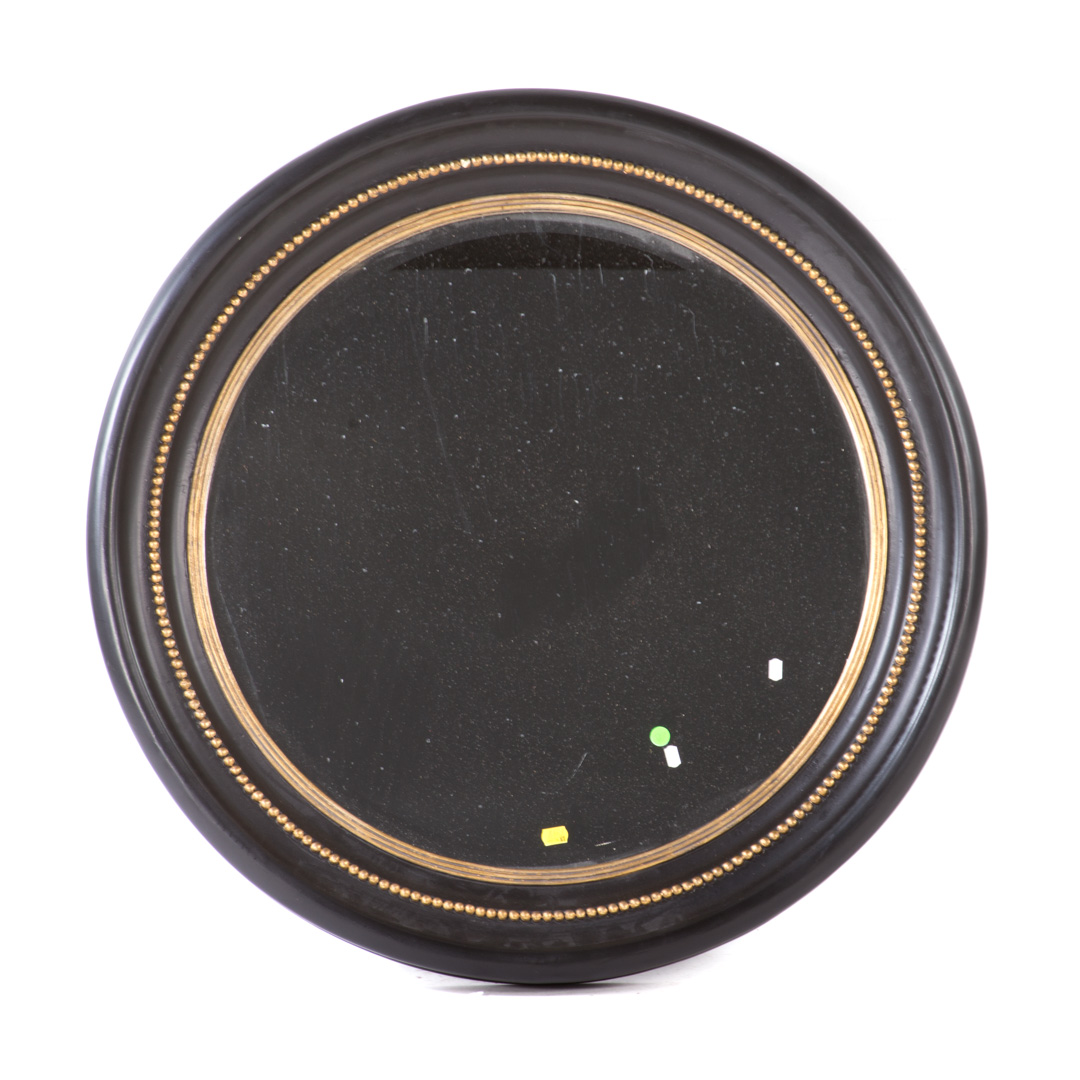 Appraisal: Contemporary ebonized parcel-gilt circular mirror in Diam Condition Paint loss