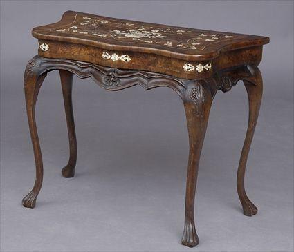 Appraisal: ITALIAN ROCOCO IVORY-INLAID WALNUT CONSOLE TABLE The cross-banded serpentine-fronted top