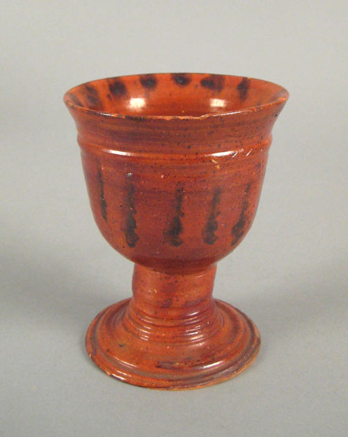 Appraisal: Pennsylvania redware goblet ca with manganese splash decoration and pencil