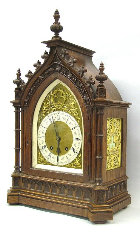 Appraisal: Good German oak Gothic style two train mantel clock the