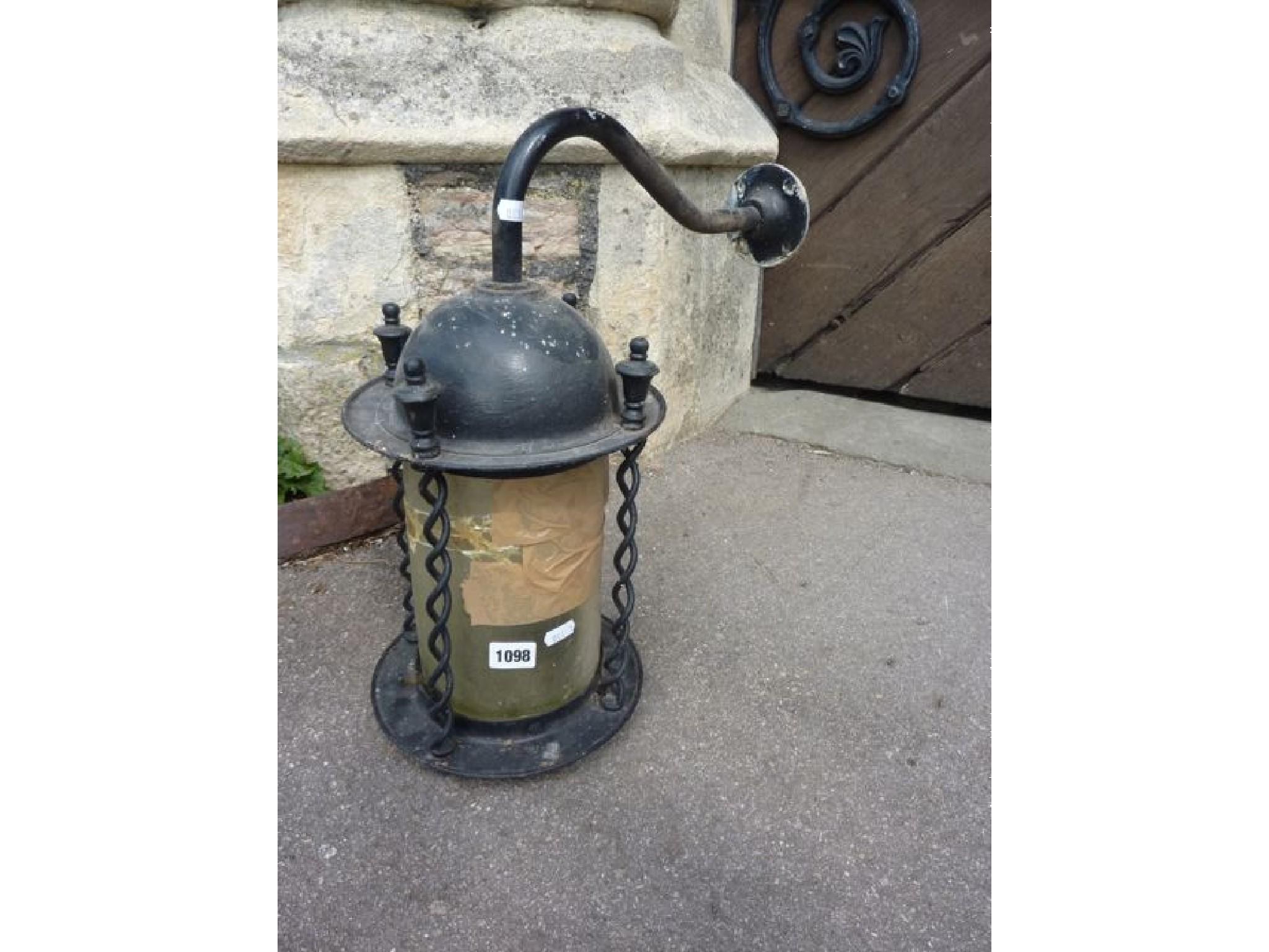 Appraisal: An iron work porch lantern of cylindrical form with open