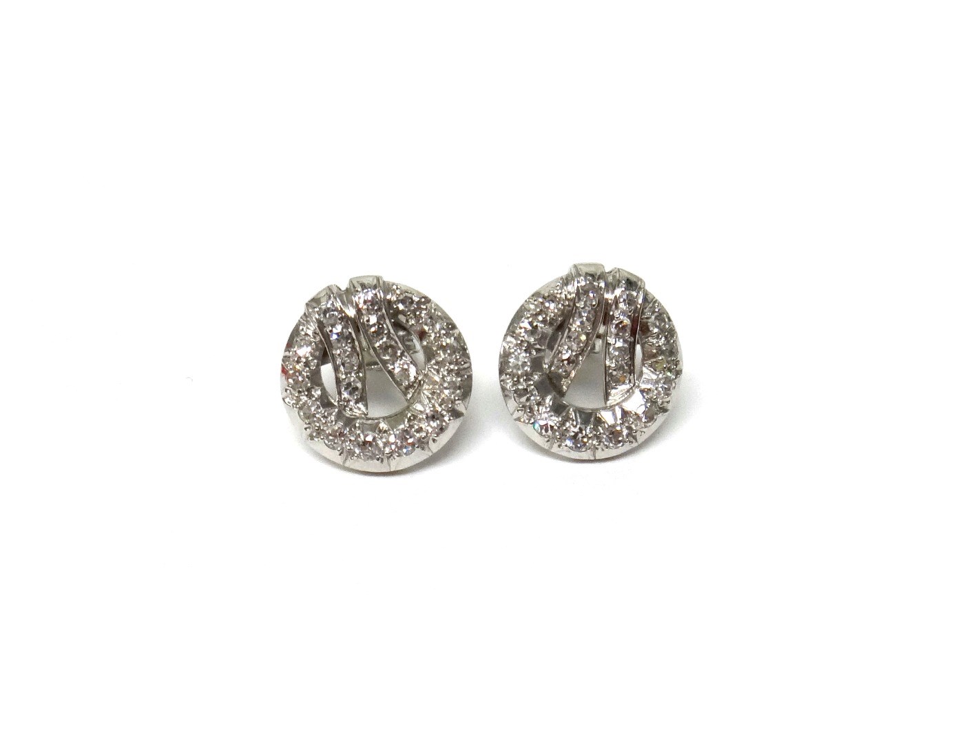 Appraisal: A pair of white gold and diamond set earstuds each