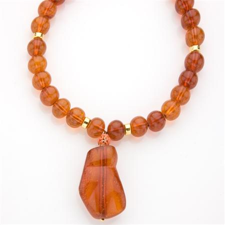 Appraisal: Amber Bead and Yellow Metal Pendant-Necklace Estimate -