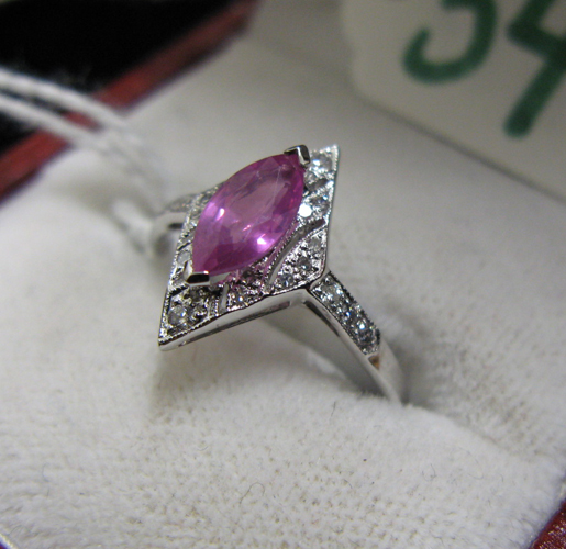 Appraisal: PINK SAPPHIRE DIAMOND AND EIGHTEEN KARAT WHITE GOLD RING centering