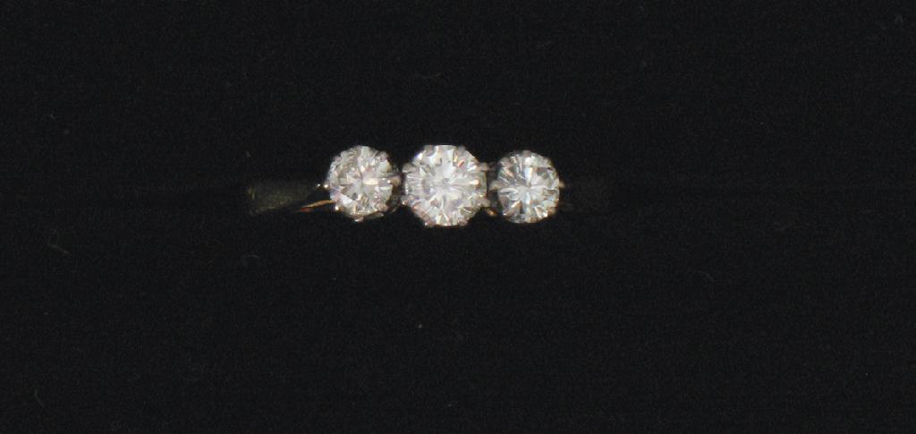 Appraisal: A THREE STONE DIAMOND RING the three graduated round-cut diamonds