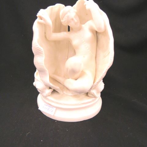 Appraisal: Rare Porcelain Figurine of a Nude emergingfrom a shell dolphins