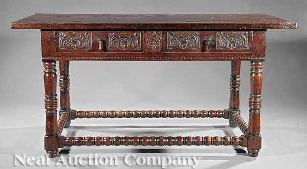 Appraisal: An Italian Renaissance-Style Carved Elm Table rectangular top frieze fitted