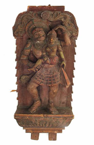 Appraisal: An Indian Polychrome wood architectural fragment depicting a male figure