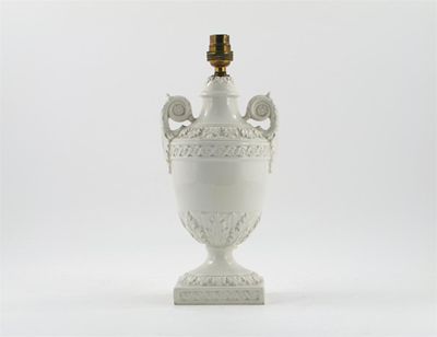 Appraisal: An Italian white glazed floral lamp with moulded floral decoration