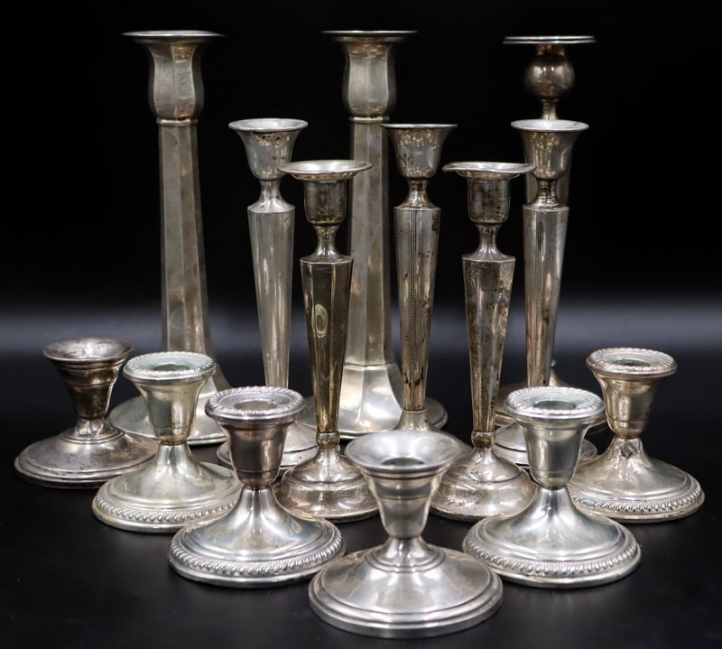 Appraisal: STERLING STERLING WEIGHTED CANDLESTICKS Including a pair of Frank M