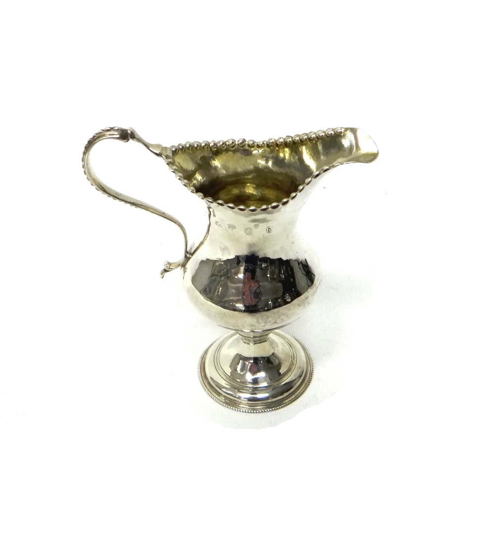 Appraisal: A George III silver milk jug of pear shaped form