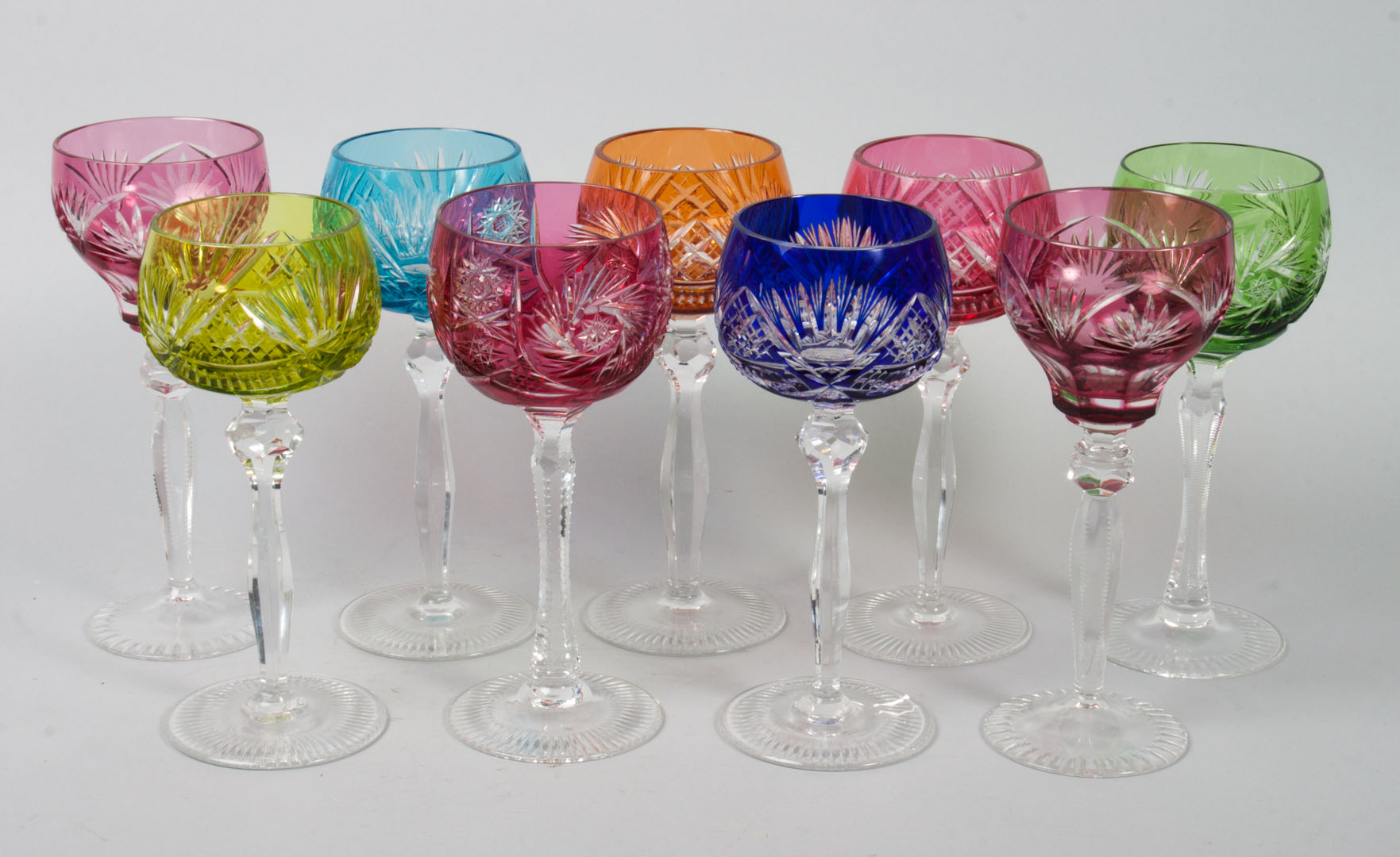 Appraisal: Czecho-Bohemian cut-to-clear wine stems colors include cranberry cobalt emerald and