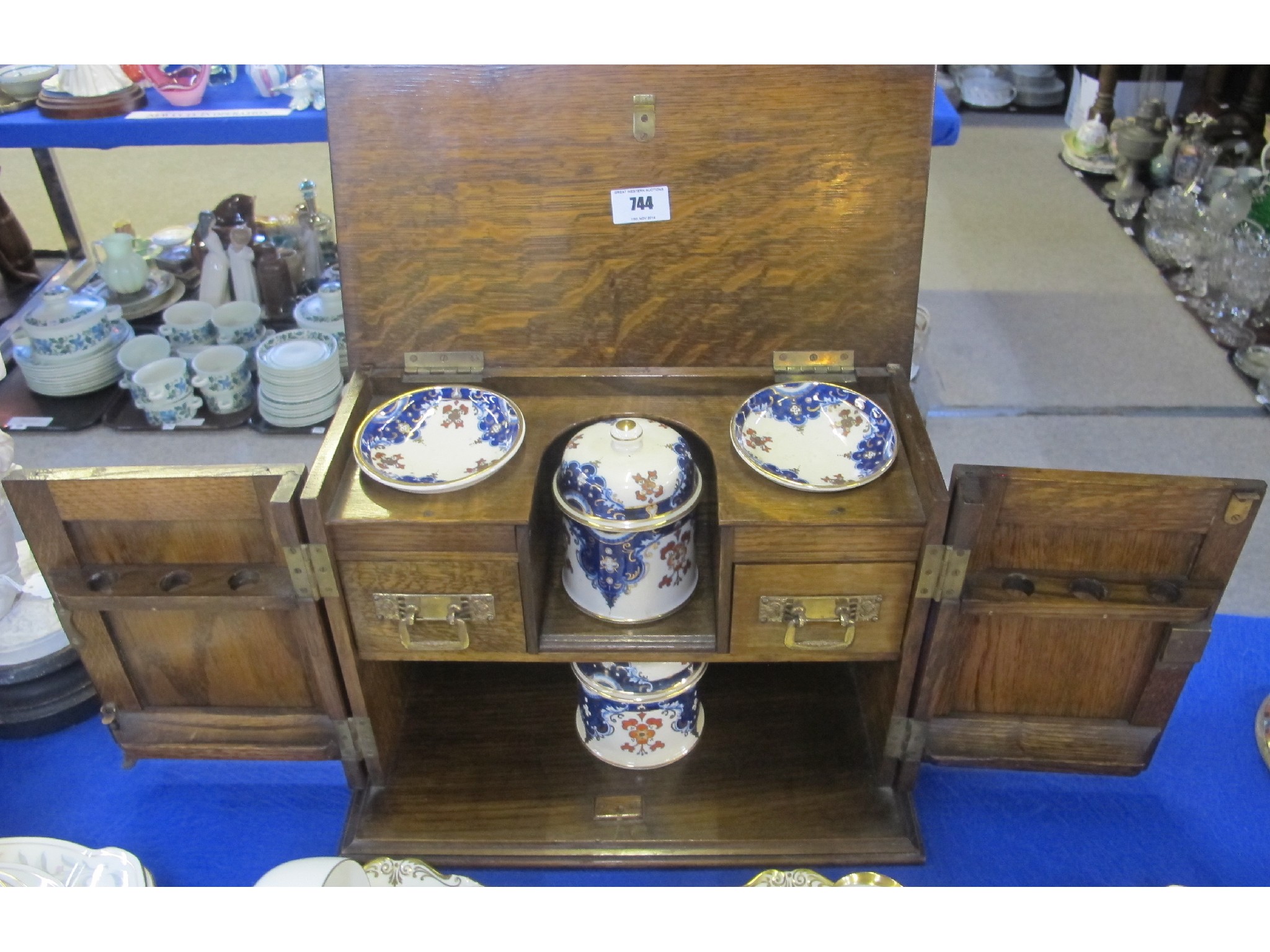 Appraisal: Oak pipe cabinet the two doors opening to reveal two