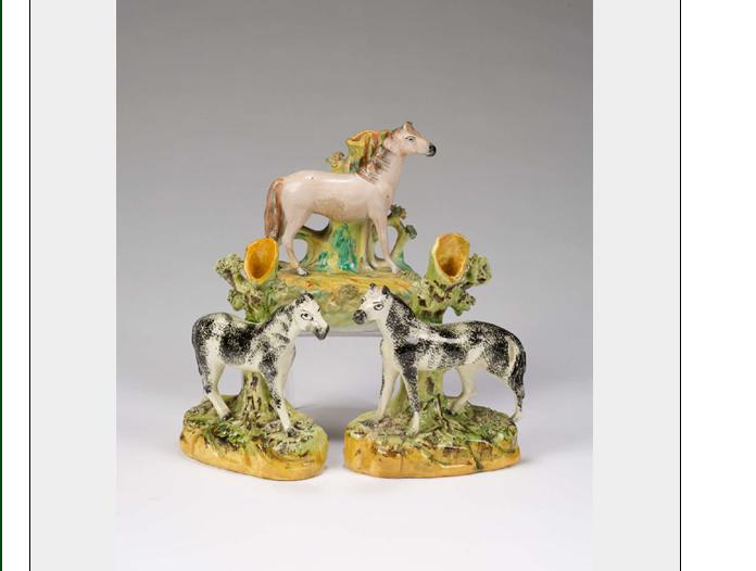 Appraisal: PAIR OF STAFFORDSHIRE HORSE-FORM SPILL VASES EARLY TWENTIETH CENTURY Together