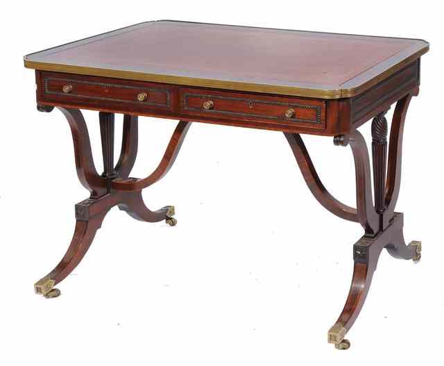 Appraisal: A REGENCY STYLE MAHOGANY AND BRASS MOUNTED LIBRARY TABLE fitted